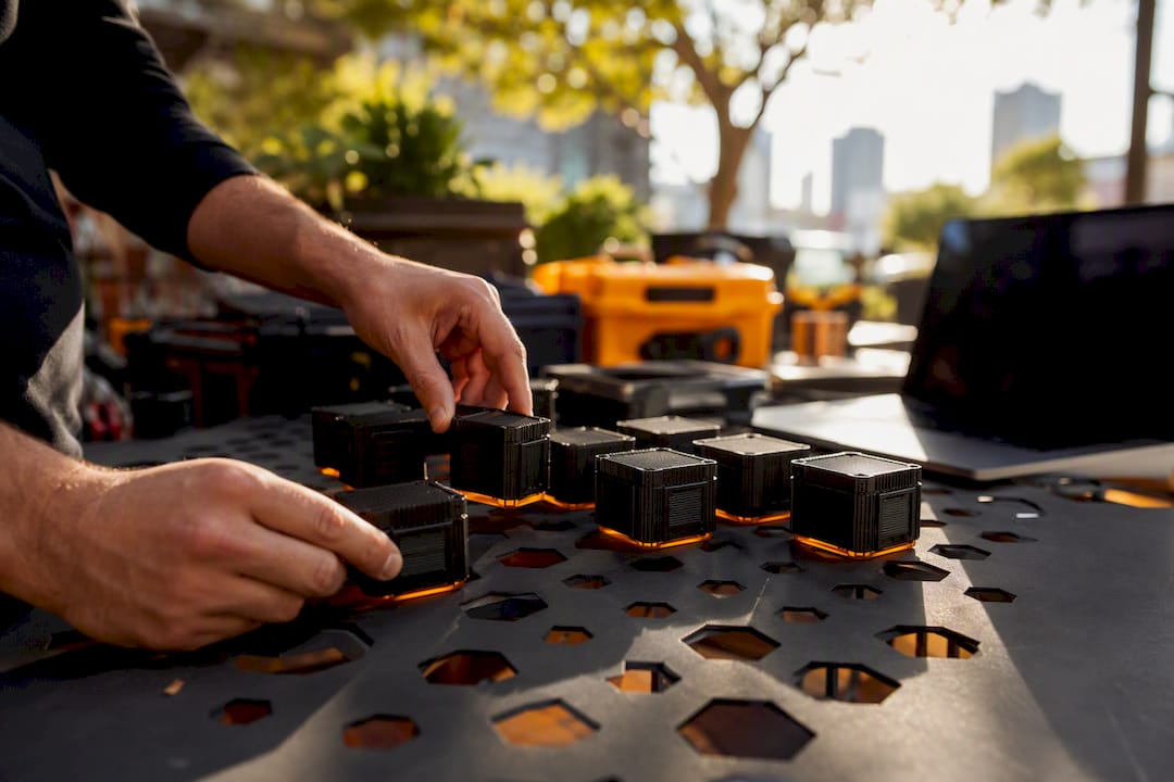 Hands assembling modular AI agent containers