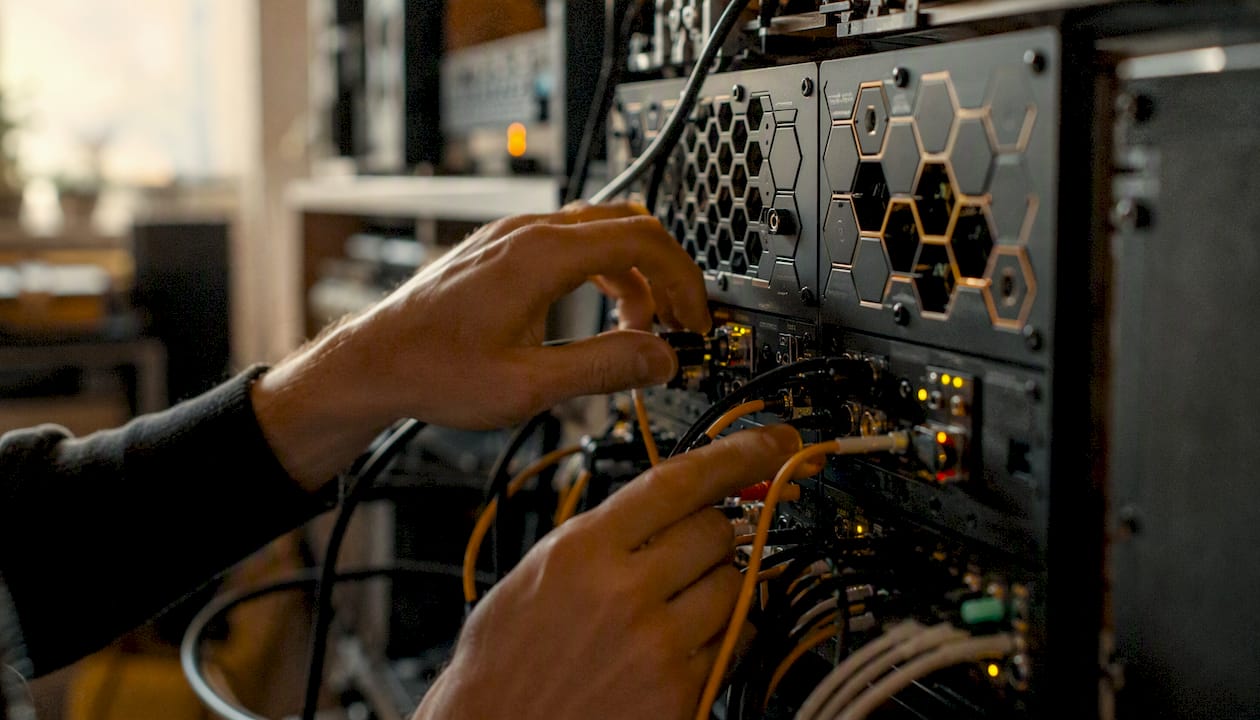 Hands connecting components in AI workflow setup